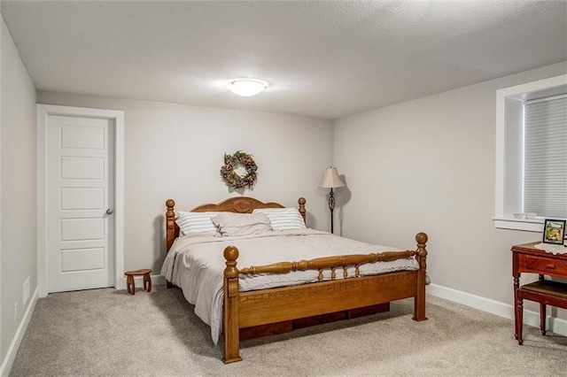 bedroom with light carpet