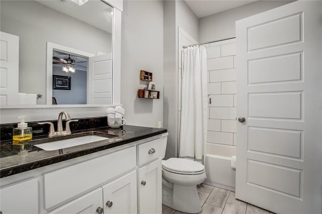 full bathroom with ceiling fan, toilet, vanity, and shower / tub combo with curtain