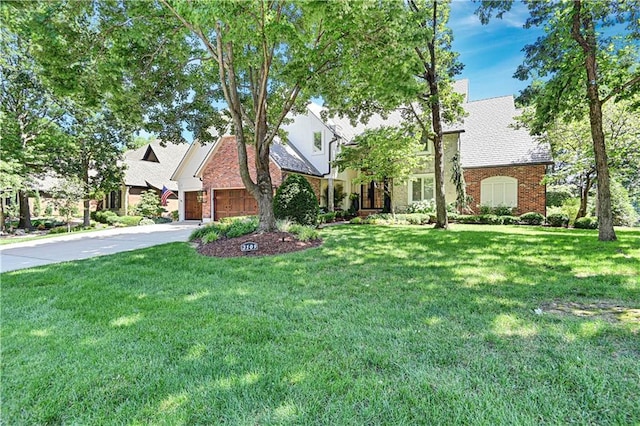 view of front of house featuring a garage and a front yard