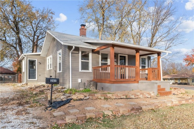 view of front of home with covered porch and cooling unit