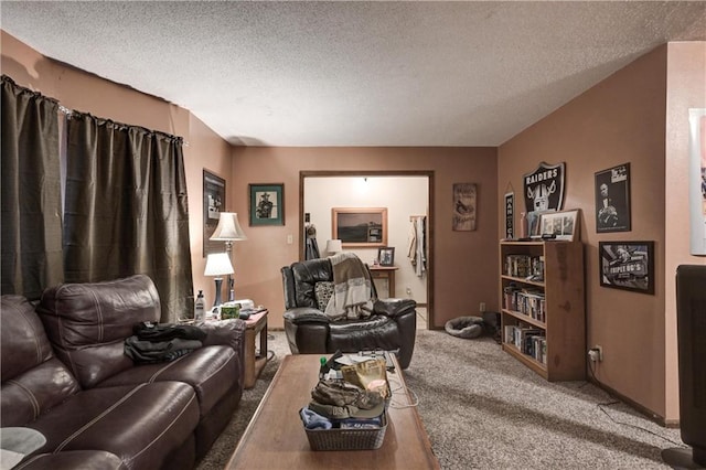 living room featuring carpet and a textured ceiling