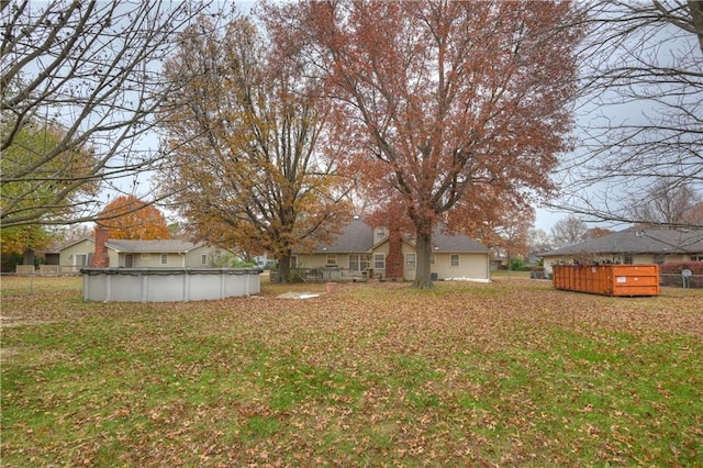 view of yard with a covered pool