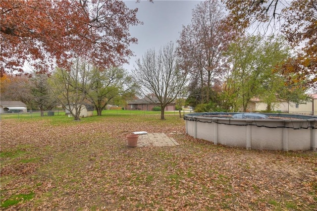 view of yard featuring a covered pool