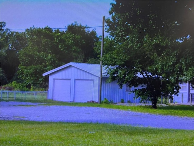 garage with a yard