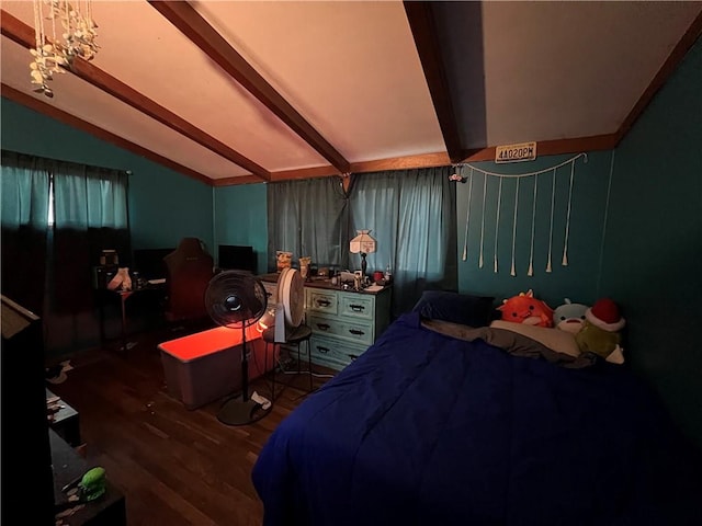 bedroom with vaulted ceiling with beams and wood finished floors