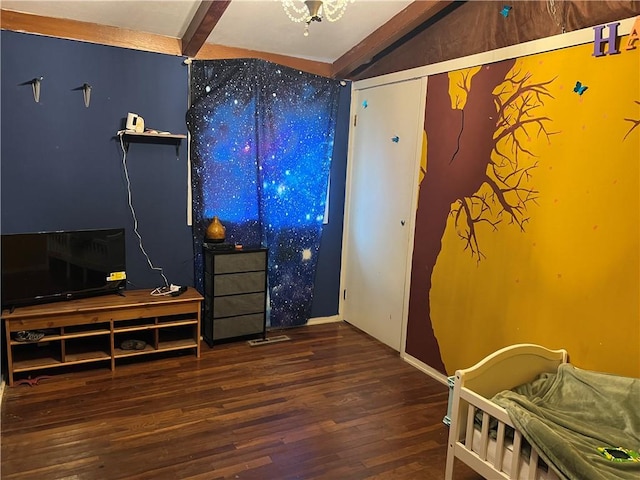 bedroom featuring beam ceiling and dark wood-type flooring