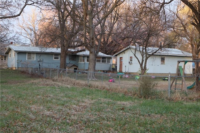 exterior space featuring a lawn and fence private yard