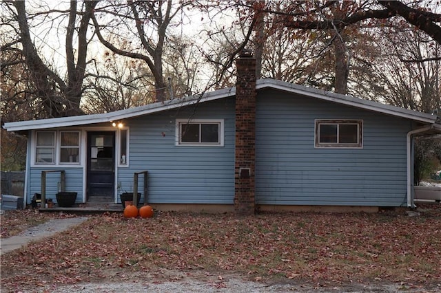 view of front of home with a chimney