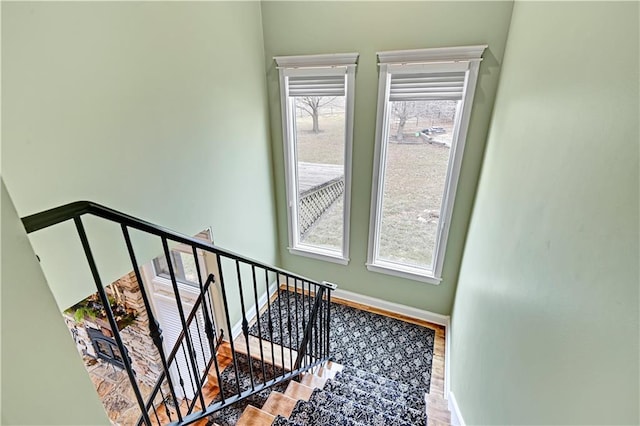 stairway featuring plenty of natural light