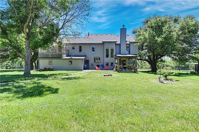 back of house featuring a yard and a patio area