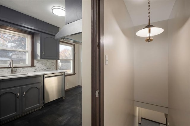 kitchen with gray cabinetry, dishwasher, hanging light fixtures, and sink