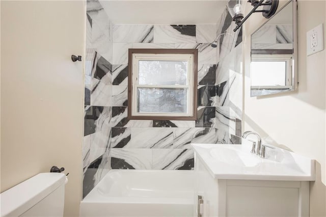 full bathroom featuring plenty of natural light, vanity, shower / bathtub combination, and toilet