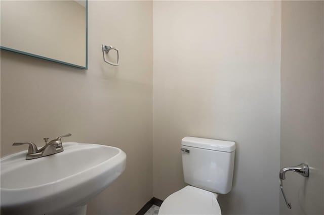 bathroom with sink and toilet