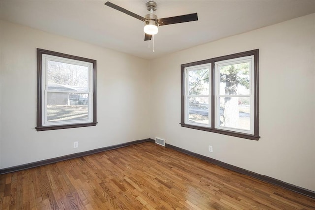 unfurnished room featuring ceiling fan and wood-type flooring