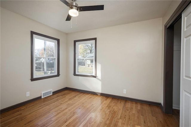 unfurnished bedroom featuring ceiling fan and light wood-type flooring