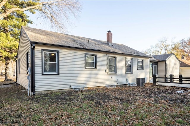 back of property featuring central AC unit