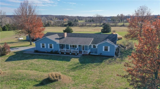 ranch-style home featuring a porch and a front lawn