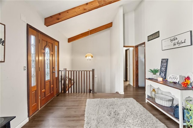 foyer entrance featuring beamed ceiling, dark hardwood / wood-style flooring, and high vaulted ceiling