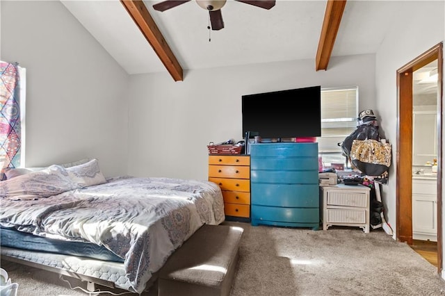 bedroom featuring carpet flooring, lofted ceiling with beams, ceiling fan, and ensuite bathroom