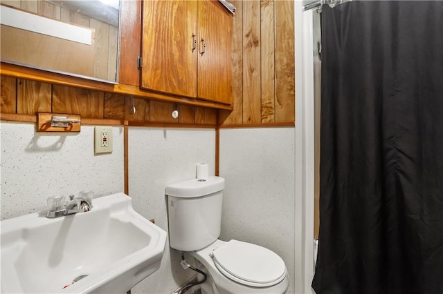 bathroom featuring sink and toilet