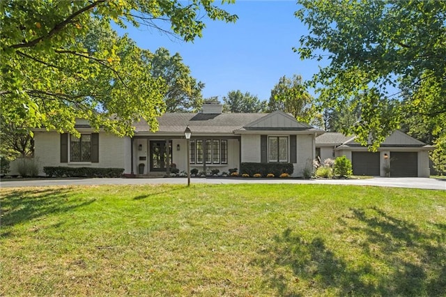 ranch-style house featuring a garage and a front yard