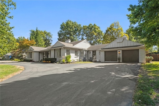 ranch-style home featuring a garage