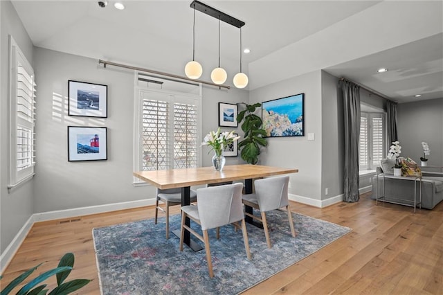 dining room featuring a healthy amount of sunlight and light wood-type flooring