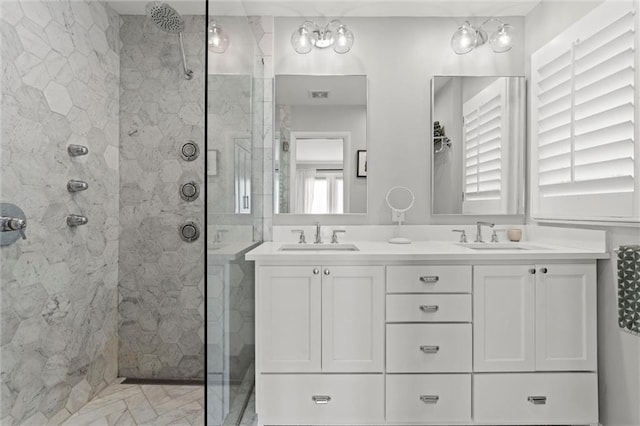 bathroom with vanity and a shower with shower door