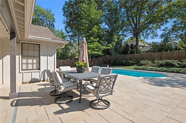 view of patio / terrace with a fenced in pool