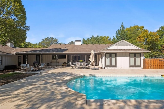 view of swimming pool with a patio area