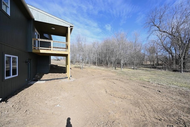 view of yard featuring a balcony