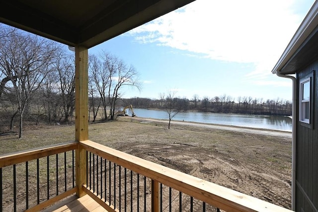 wooden deck with a water view