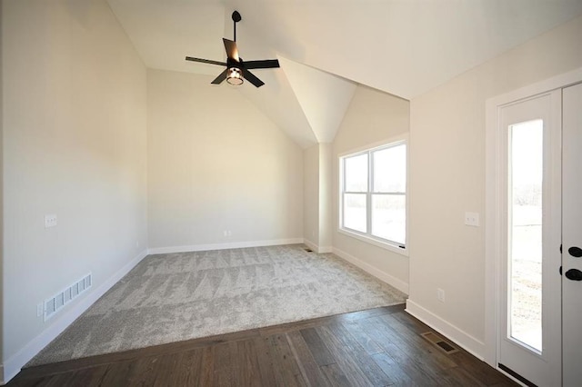 foyer with dark hardwood / wood-style flooring, vaulted ceiling, and ceiling fan