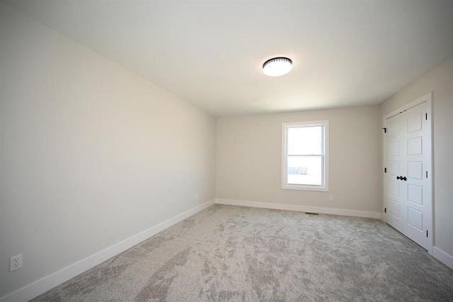 unfurnished room with carpet