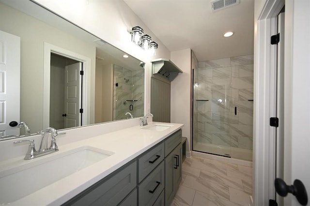 bathroom with vanity and an enclosed shower