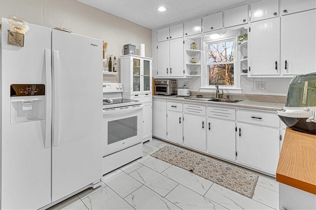 kitchen with white cabinetry, sink, a textured ceiling, white appliances, and decorative backsplash