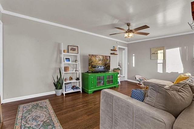 living room with ceiling fan, crown molding, and dark wood-type flooring