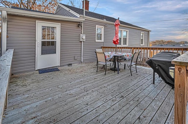 wooden deck featuring area for grilling