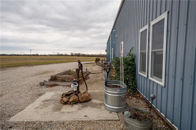 view of yard with a rural view