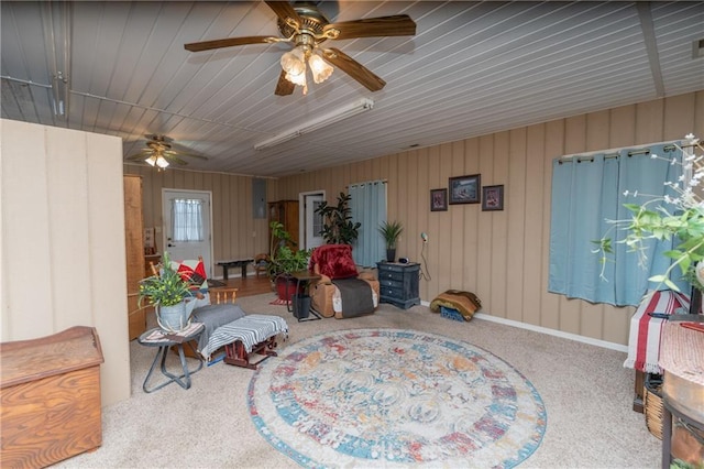 sitting room featuring carpet and ceiling fan