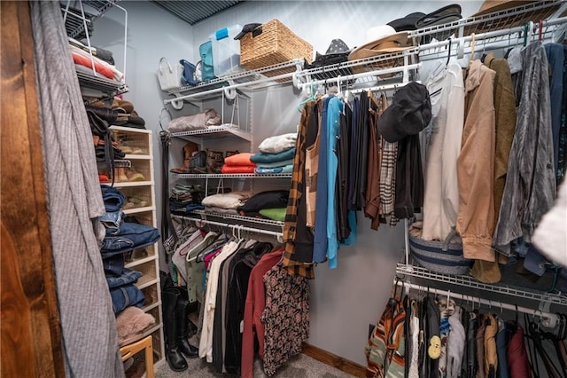 walk in closet featuring carpet