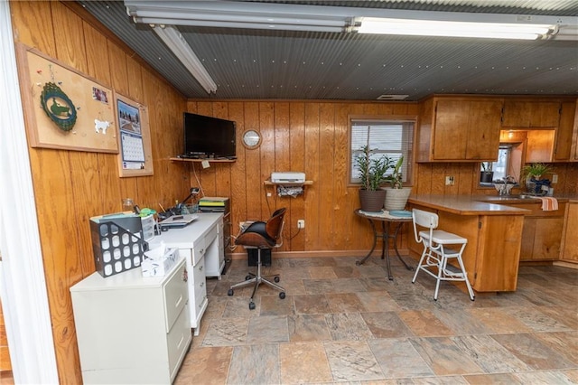 office area with wooden walls