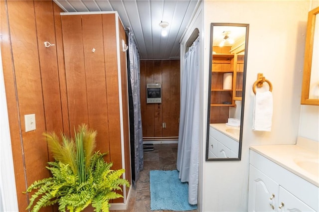 interior space with wooden ceiling, heating unit, and wooden walls