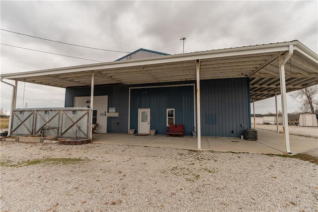 back of property with an outbuilding