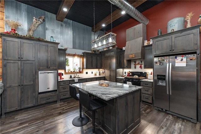 kitchen featuring a center island, beamed ceiling, stainless steel refrigerator with ice dispenser, black gas stove, and pendant lighting