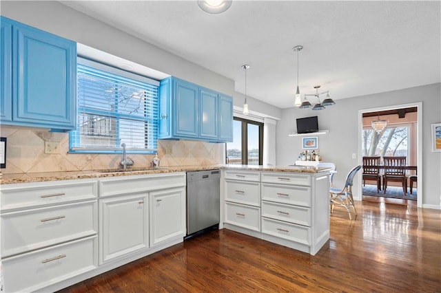 kitchen with dishwasher, blue cabinetry, dark wood-type flooring, and sink