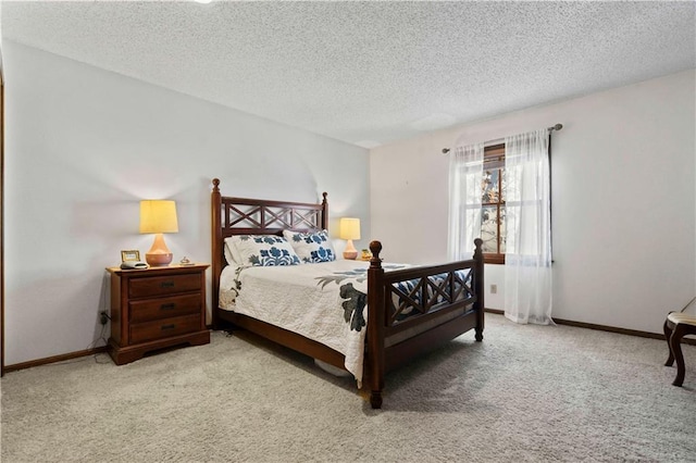 bedroom featuring carpet and a textured ceiling