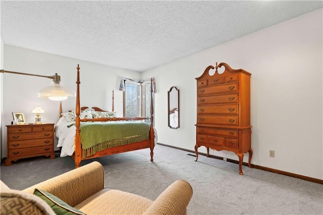 bedroom featuring a textured ceiling and carpet floors