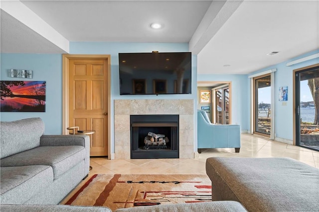 tiled living room featuring a fireplace