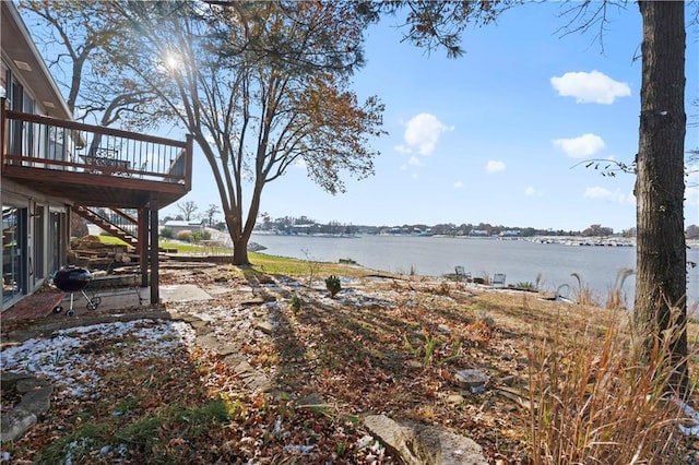 view of yard featuring a deck with water view